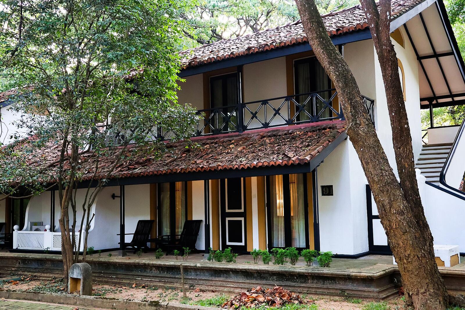 Illustrative accommodation photography for a fictional sri-lanka stay — illustrative style for Ceylon Orchid House