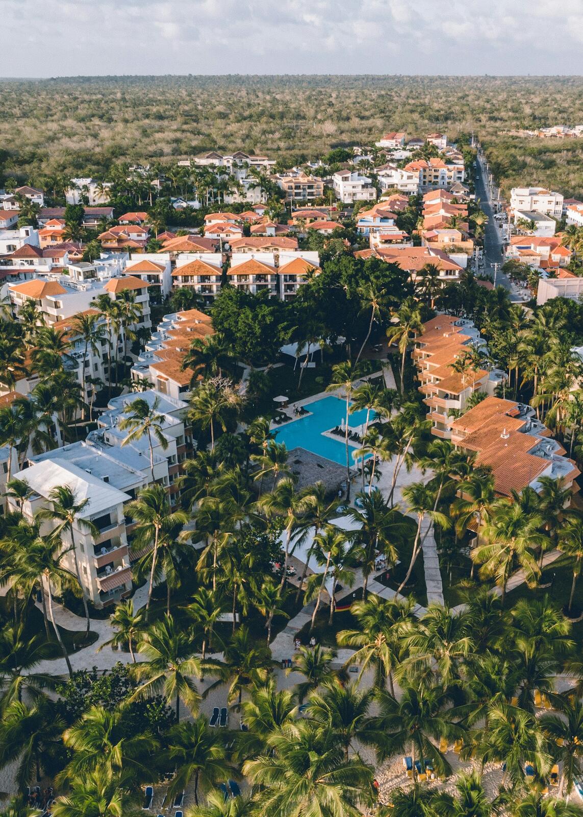 An aerial view of a resort surrounded by palm trees — illustrative property style — illustrative style for The Bridgetown Collection