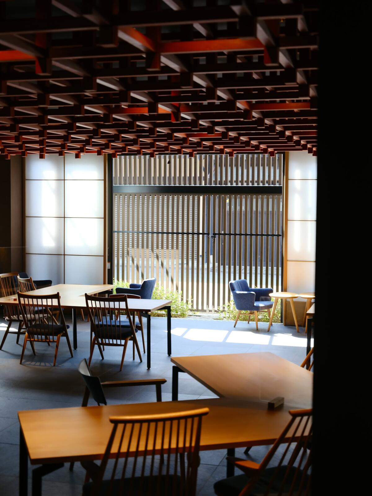 A room with a table, chairs, and a partition — illustrative property style — illustrative style for Takayama Mountain Inn