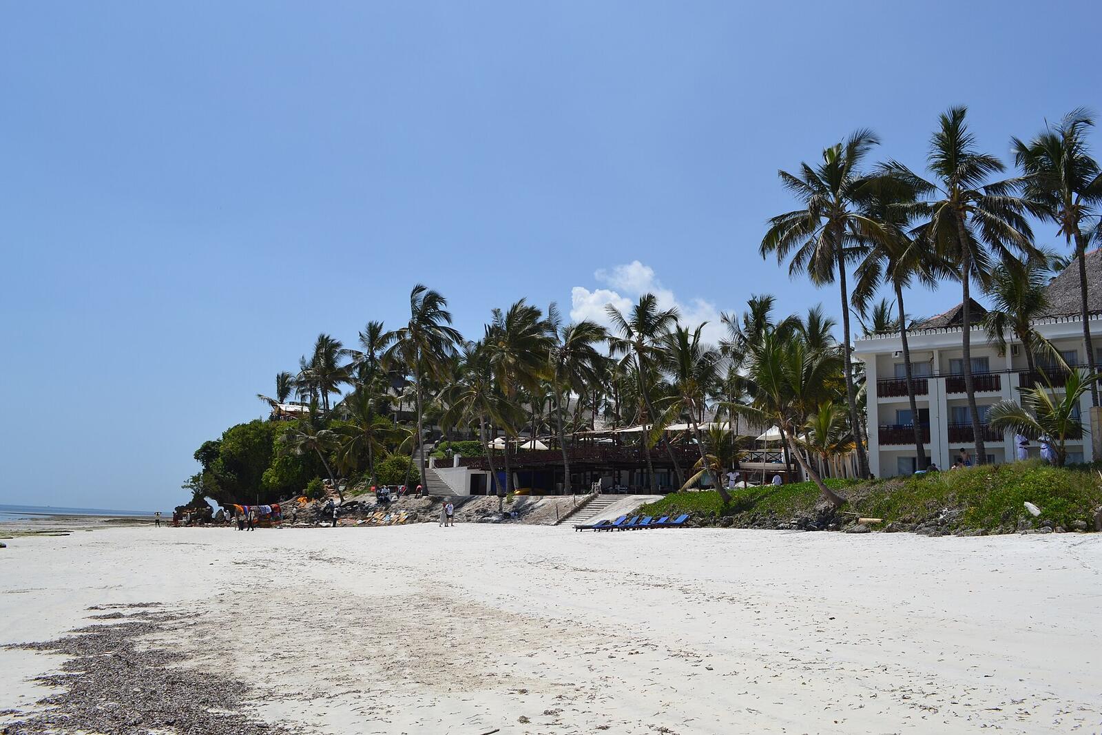 Illustrative accommodation photography for a fictional kenya stay — illustrative style for Lamu Coral Courtyard