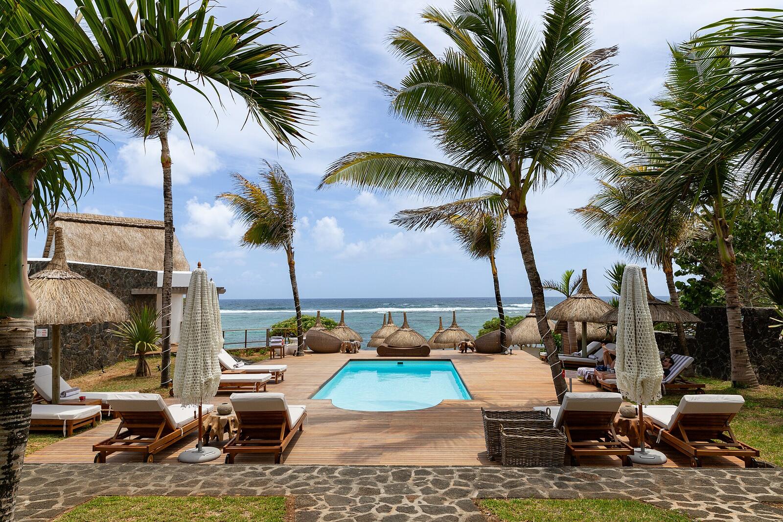 Illustrative accommodation photography for a fictional mauritius stay — illustrative style for Azur Coast Retreat