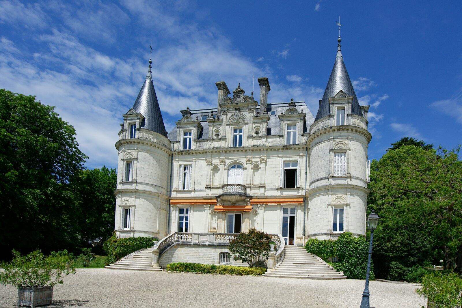 a large castle like building with a lot of windows — illustrative property style — illustrative style for Loire Orchard Retreat