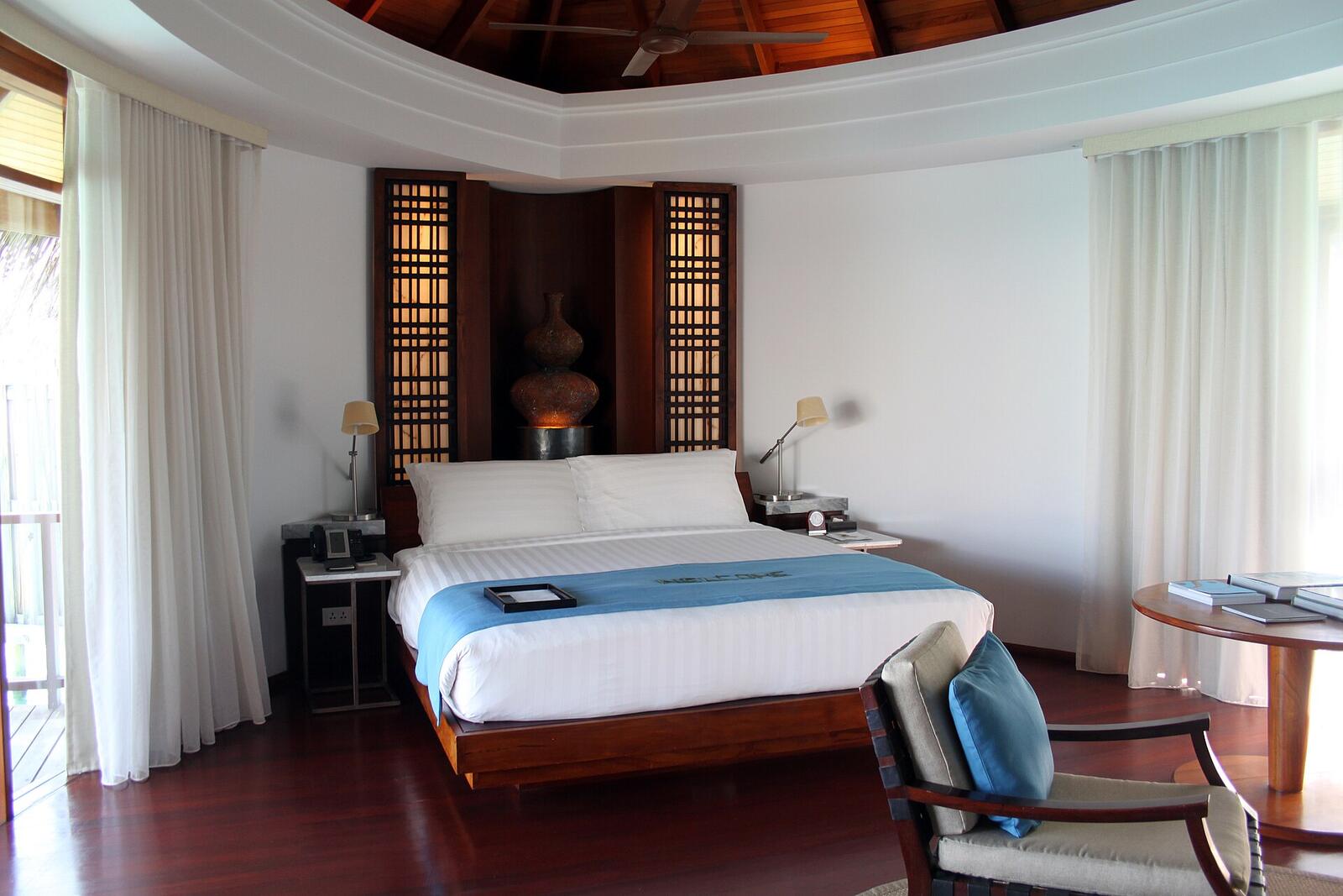 Illustrative accommodation photography for a fictional maldives stay — illustrative style for Little Reef Family Retreat