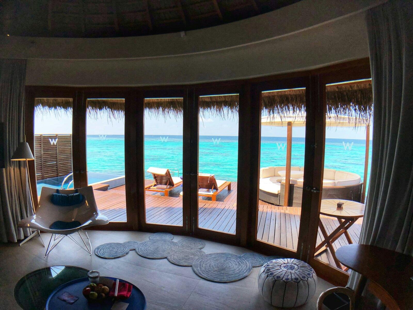 Blue and white inflatable ring on swimming pool — illustrative property style — illustrative style for Little Atoll Hideaway