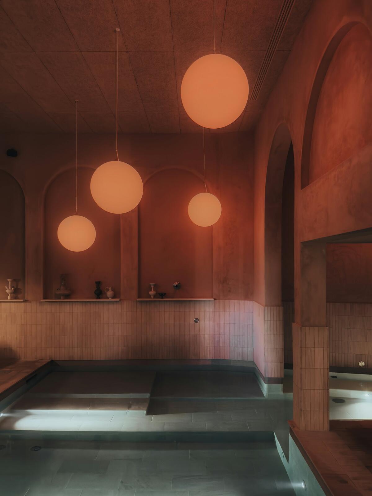 a large swimming pool with lights hanging from the ceiling — illustrative property style — illustrative style for Douro Vine Residence