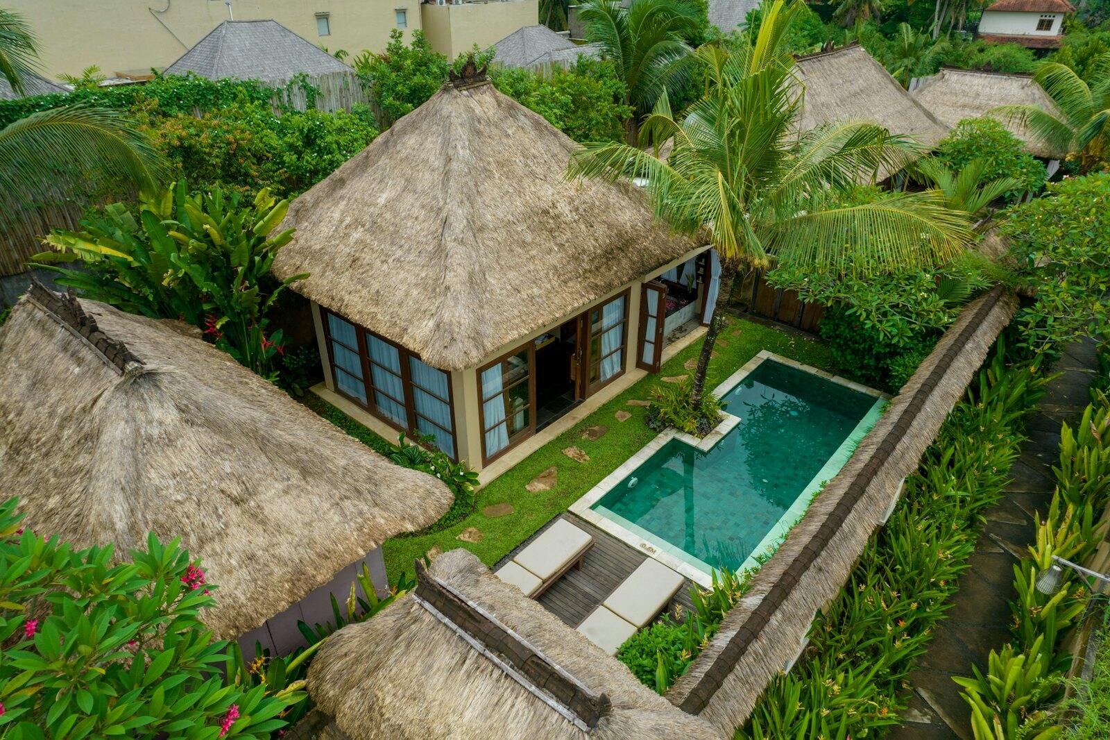 An aerial view of a tropical resort with a pool — illustrative property style — illustrative style for The Kandy Residence