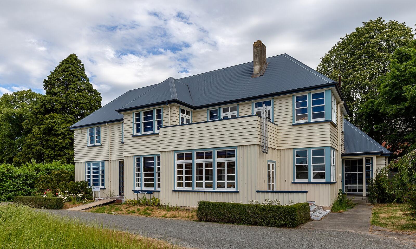 Illustrative accommodation photography for a fictional new-zealand stay — illustrative style for Coromandel Family Residence