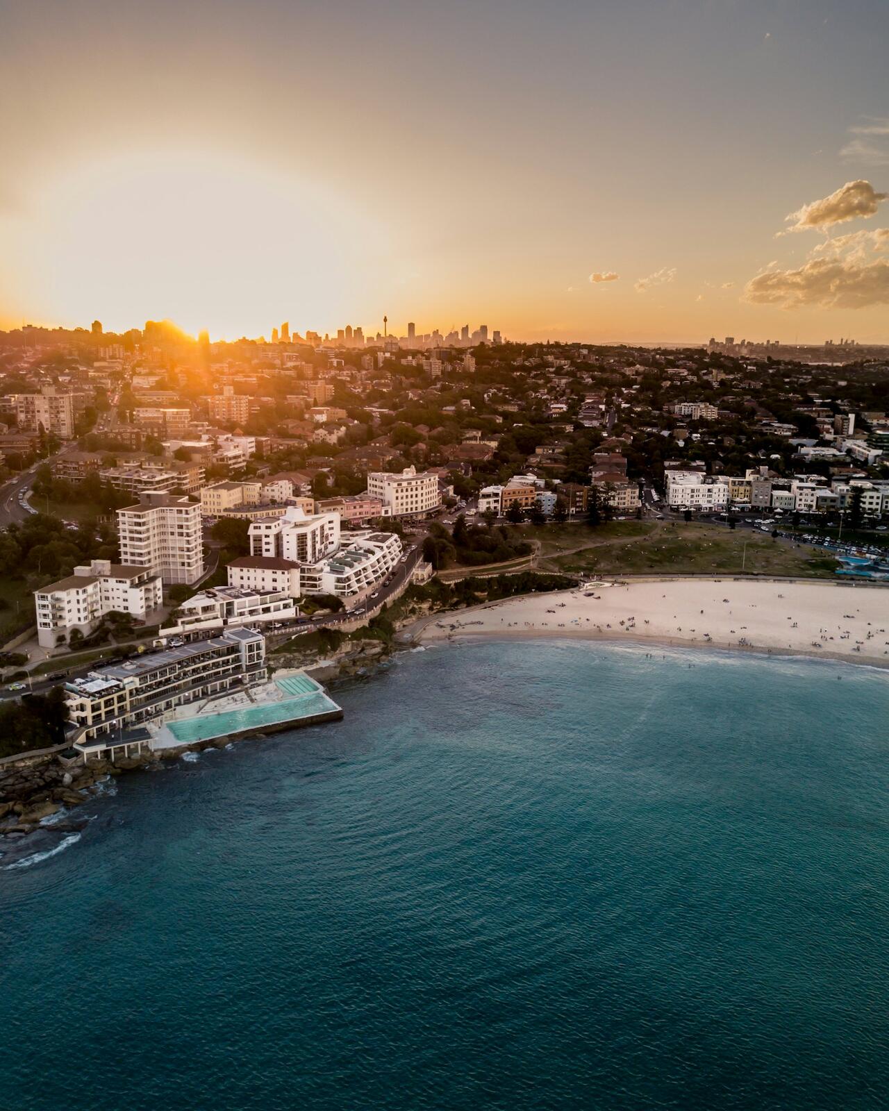 aerial view of hotel resort beside beach — illustrative property style — illustrative style for Sydney Harbour Rooms