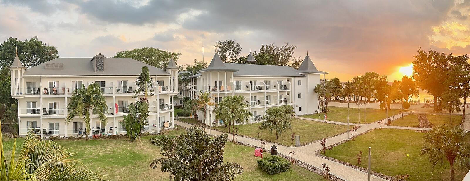 Illustrative accommodation photography for a fictional jamaica stay — illustrative style for Mango Courtyard House