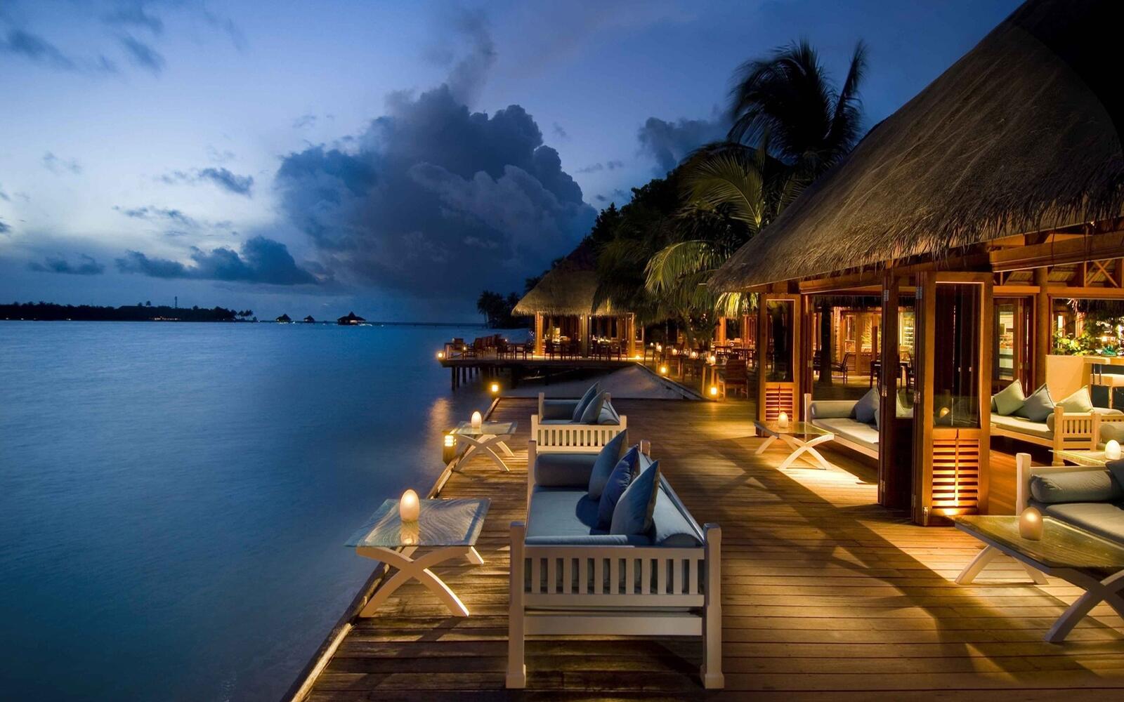Illustrative accommodation photography for a fictional maldives stay — illustrative style for Lagoon Whisper Villas