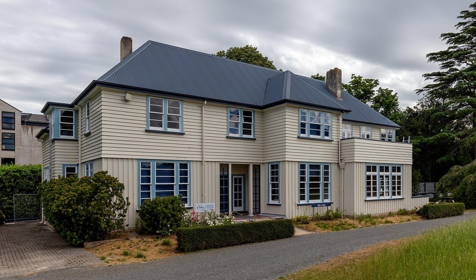 Illustrative accommodation photography for a fictional new-zealand stay — illustrative style for Fiordland Fern Lodge