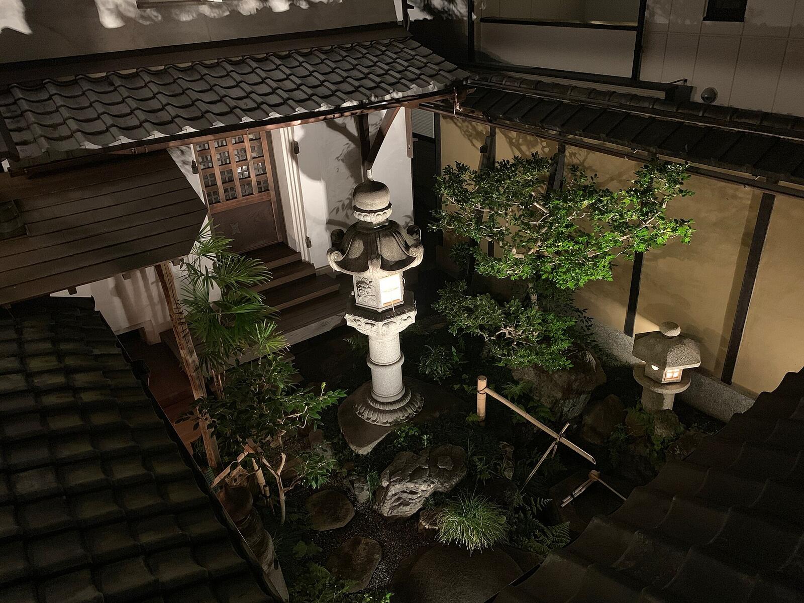 Illustrative accommodation photography for a fictional japan stay — illustrative style for Nara Maple House
