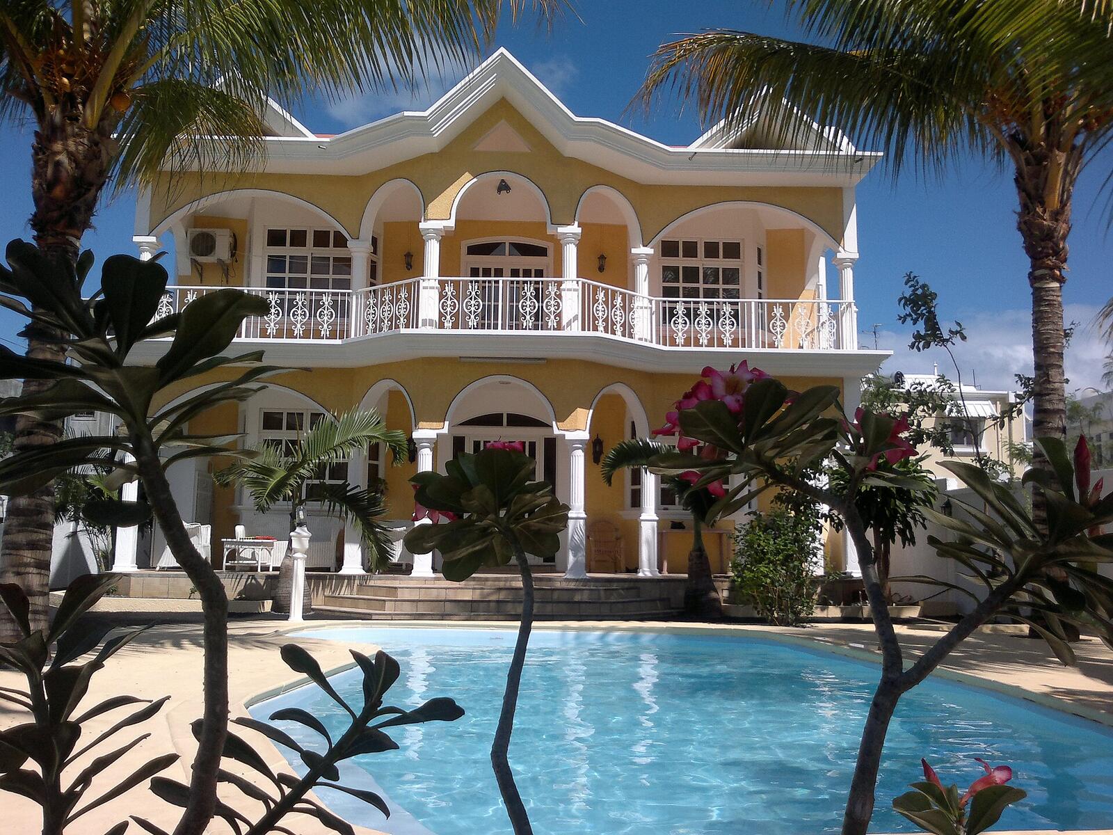 Illustrative accommodation photography for a fictional mauritius stay — illustrative style for Cap Malheureux Garden House