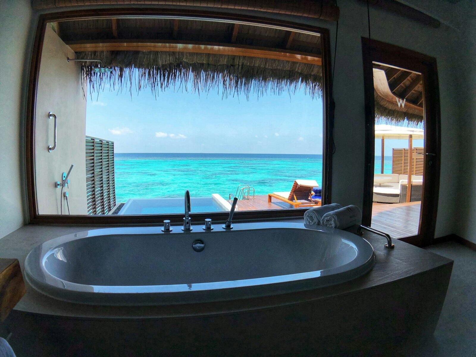 Brown and white hot tub — illustrative property style — illustrative style for Tide & Palm Residence