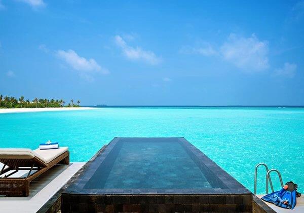 Illustrative accommodation photography for a fictional maldives stay — illustrative style for Azure Horizon Island