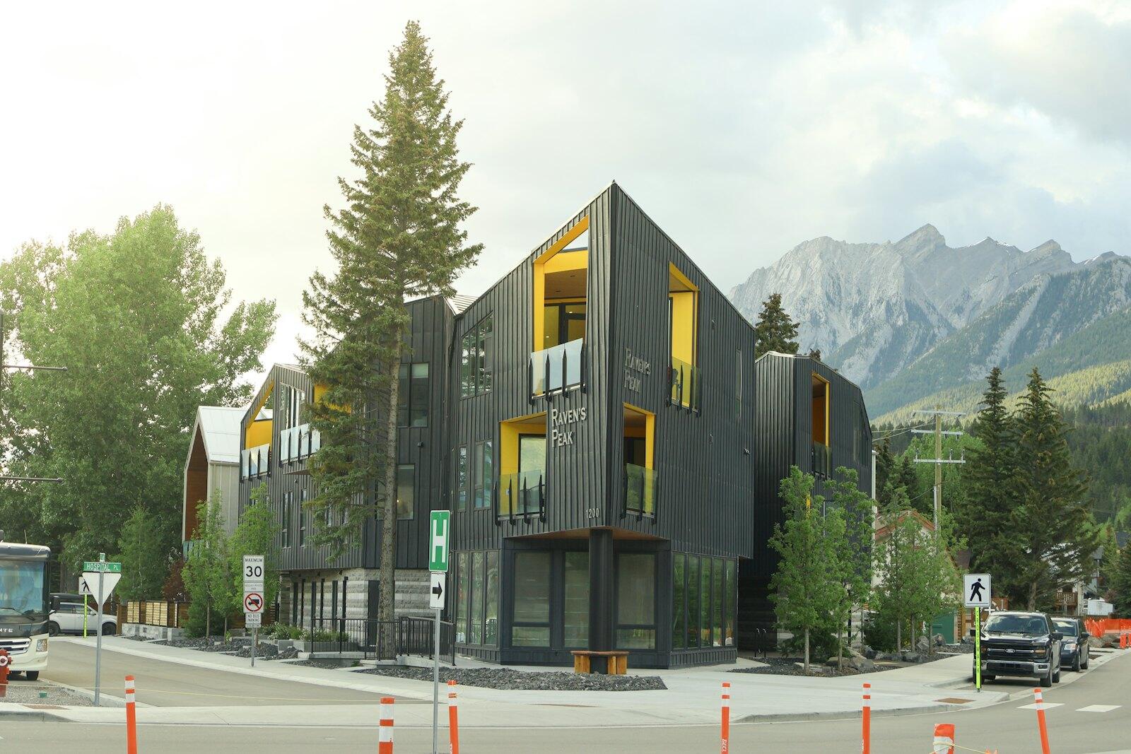 Modern building with mountain scenery in the background. — illustrative property style — illustrative style for Jasper Mountain House
