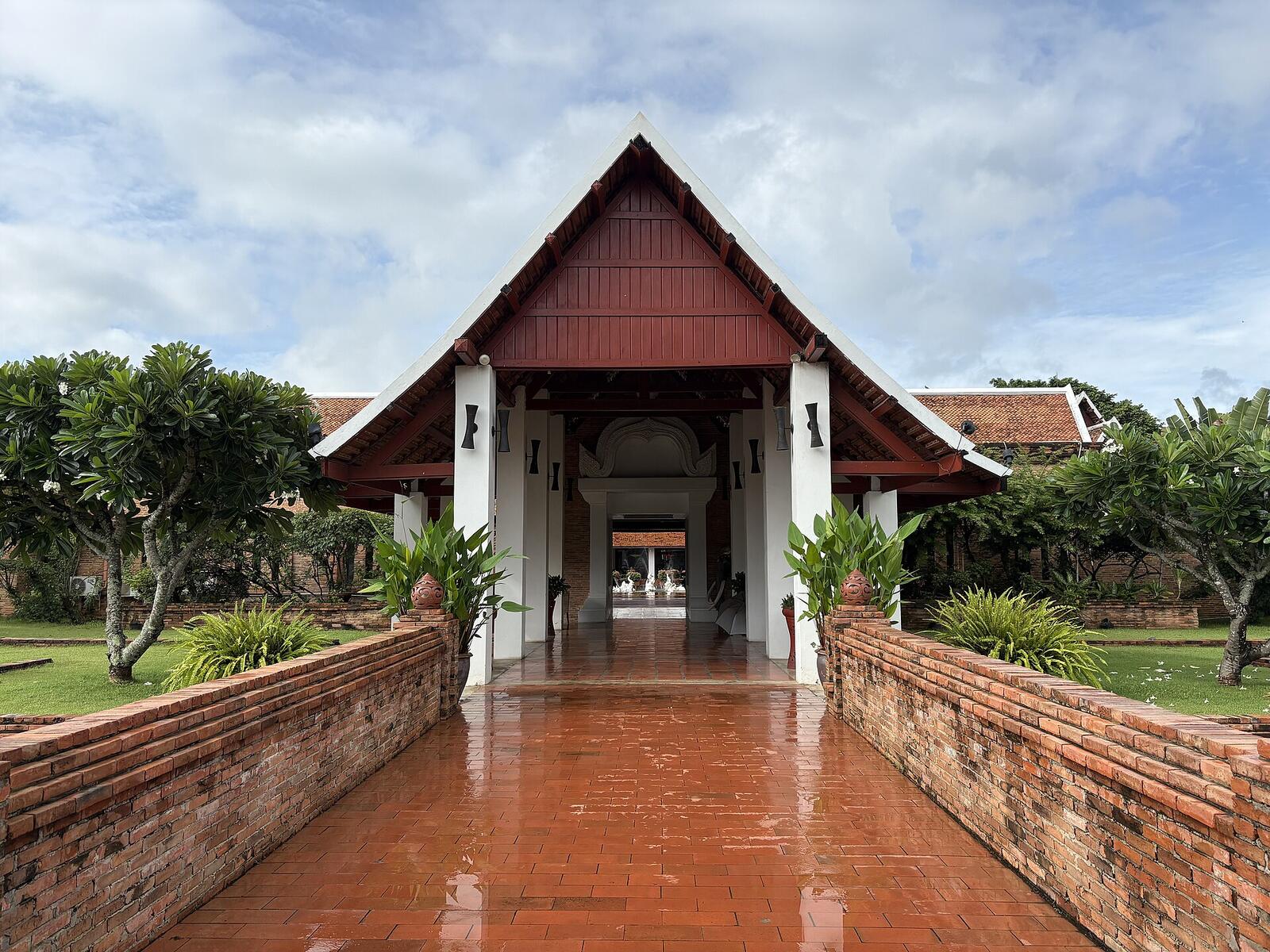 Illustrative accommodation photography for a fictional thailand stay — illustrative style for Chiang Khan Riverside Inn