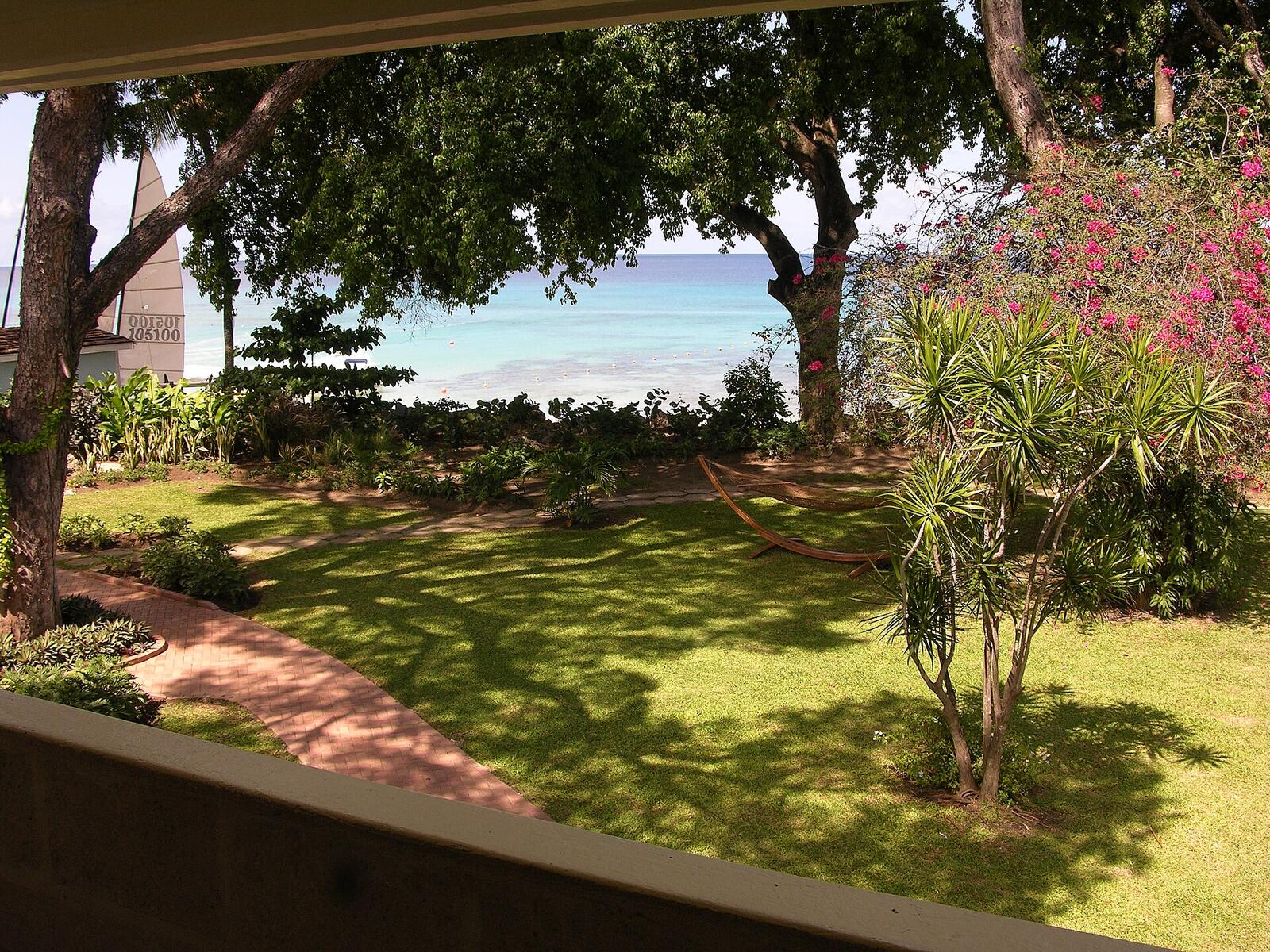 Illustrative accommodation photography for a fictional barbados stay — illustrative style for Indigo Bay Family Resort