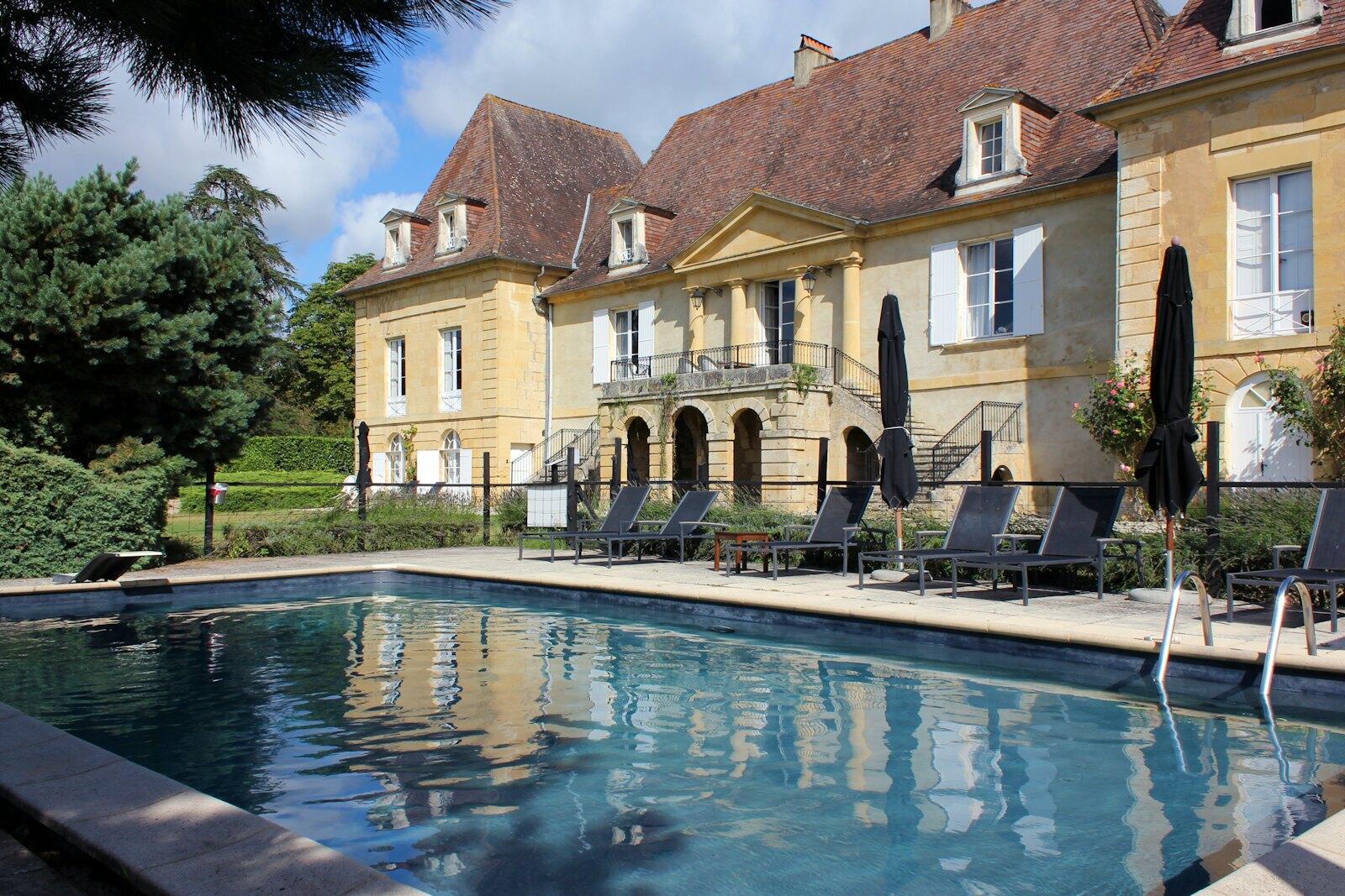 Swimming pool in front of a large chateau — illustrative property style — illustrative style for Provence Olive House