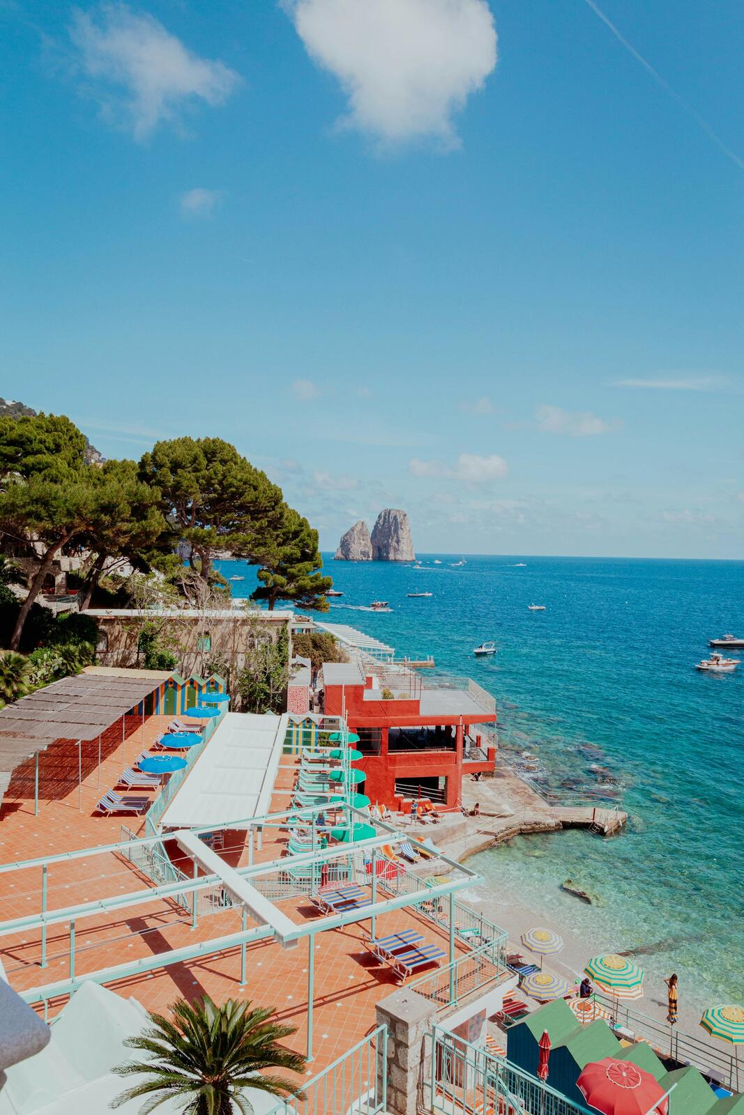 Coastal resort with ocean views and rocky islands — illustrative property style — illustrative style for Amalfi Terrace Villas
