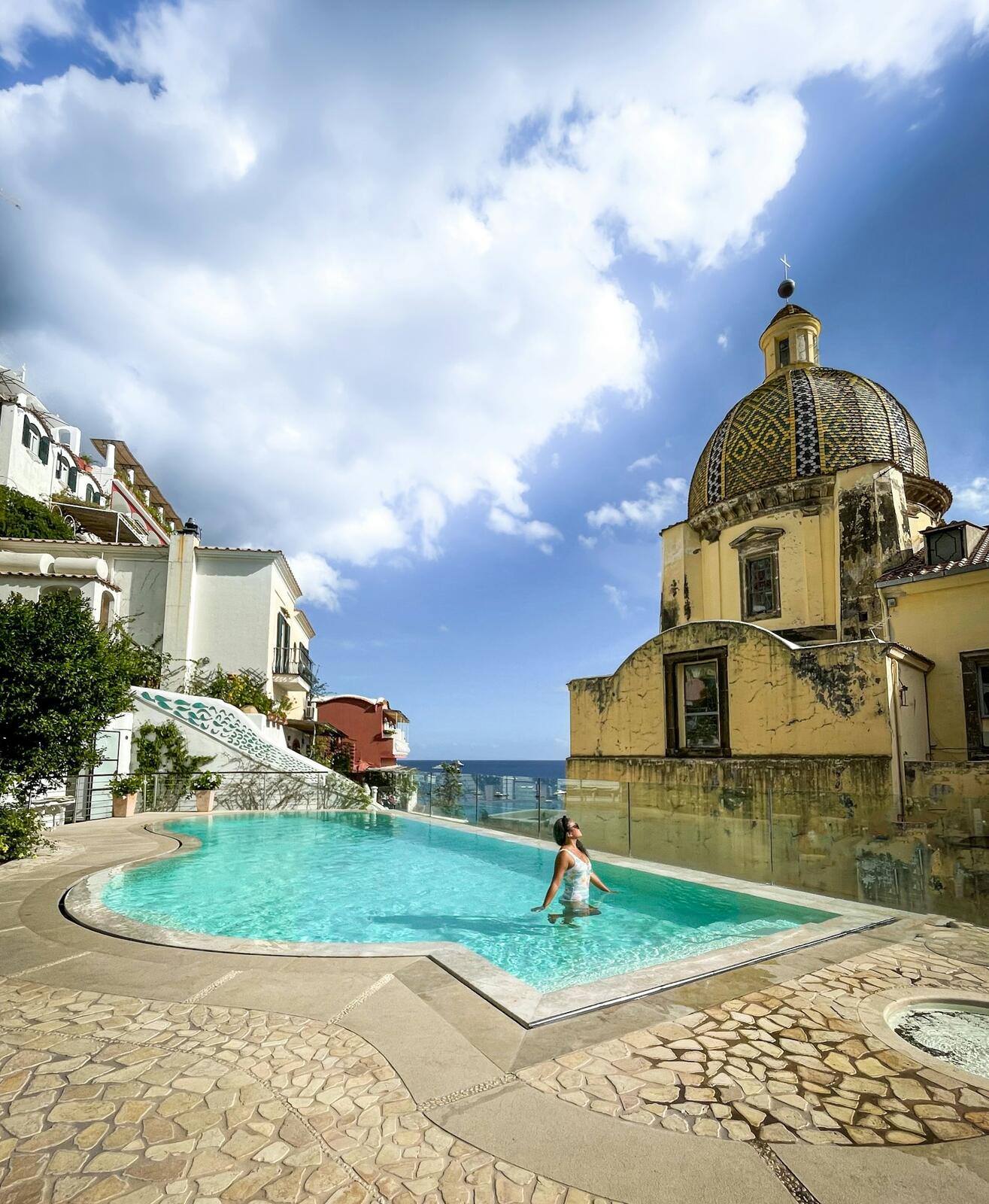 Positano hotel pool and architecture — illustrative property style — illustrative style for Florence Atelier Rooms