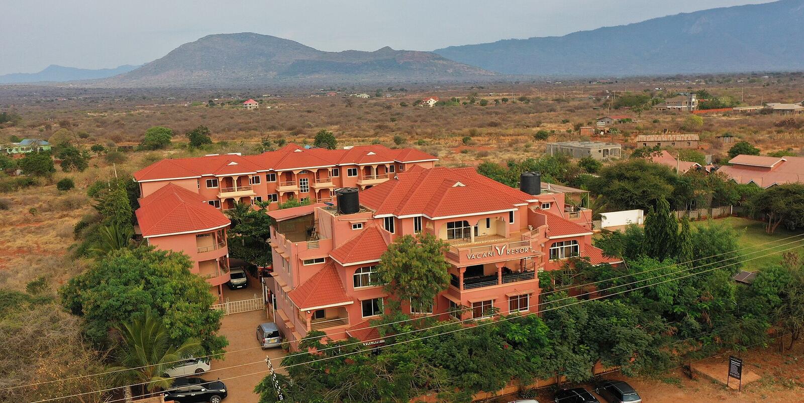 Illustrative accommodation photography for a fictional kenya stay — illustrative style for Nanyuki Garden Estate