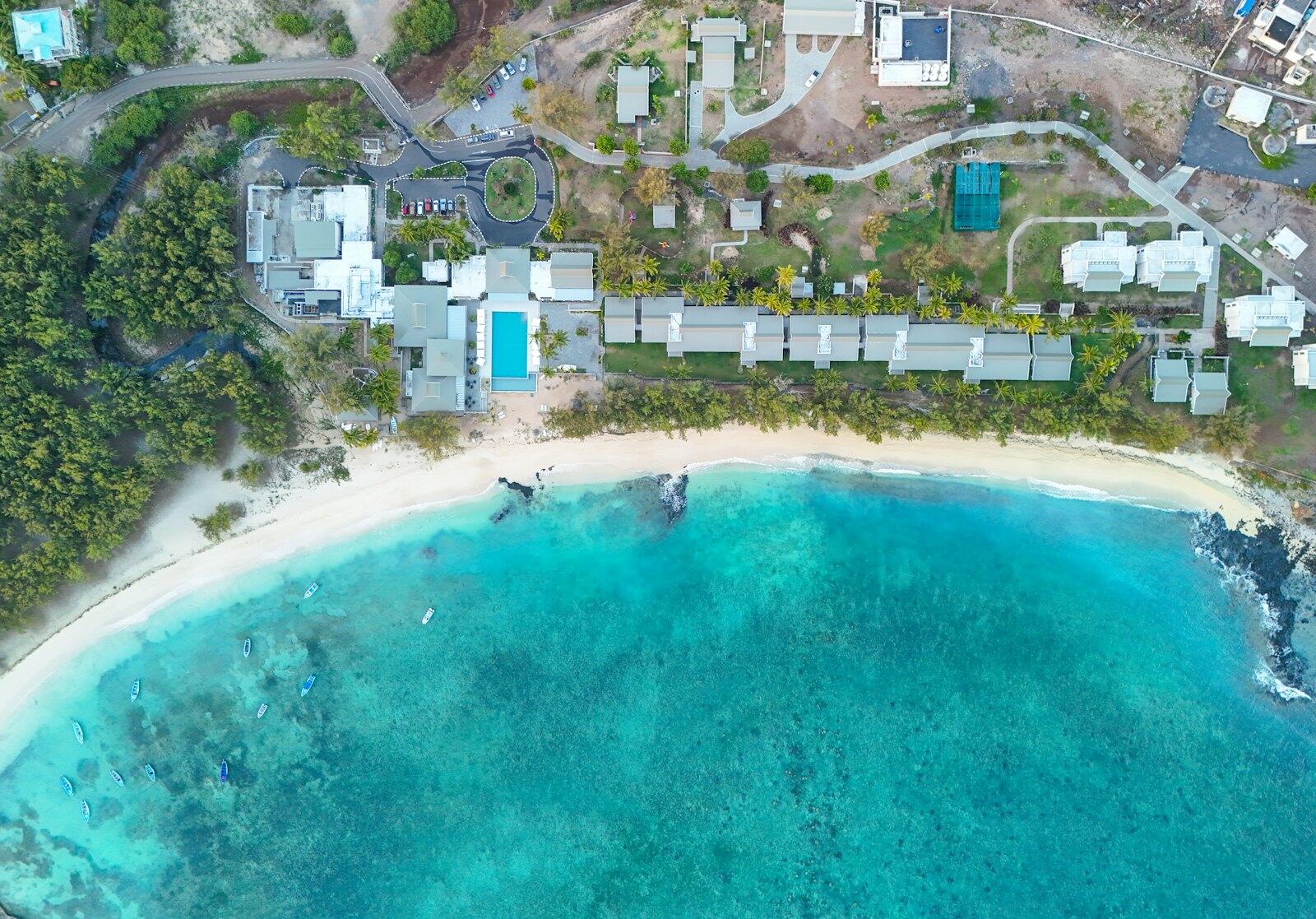 An aerial view of a beach and a resort — illustrative property style — illustrative style for Coral Coast Family Retreat