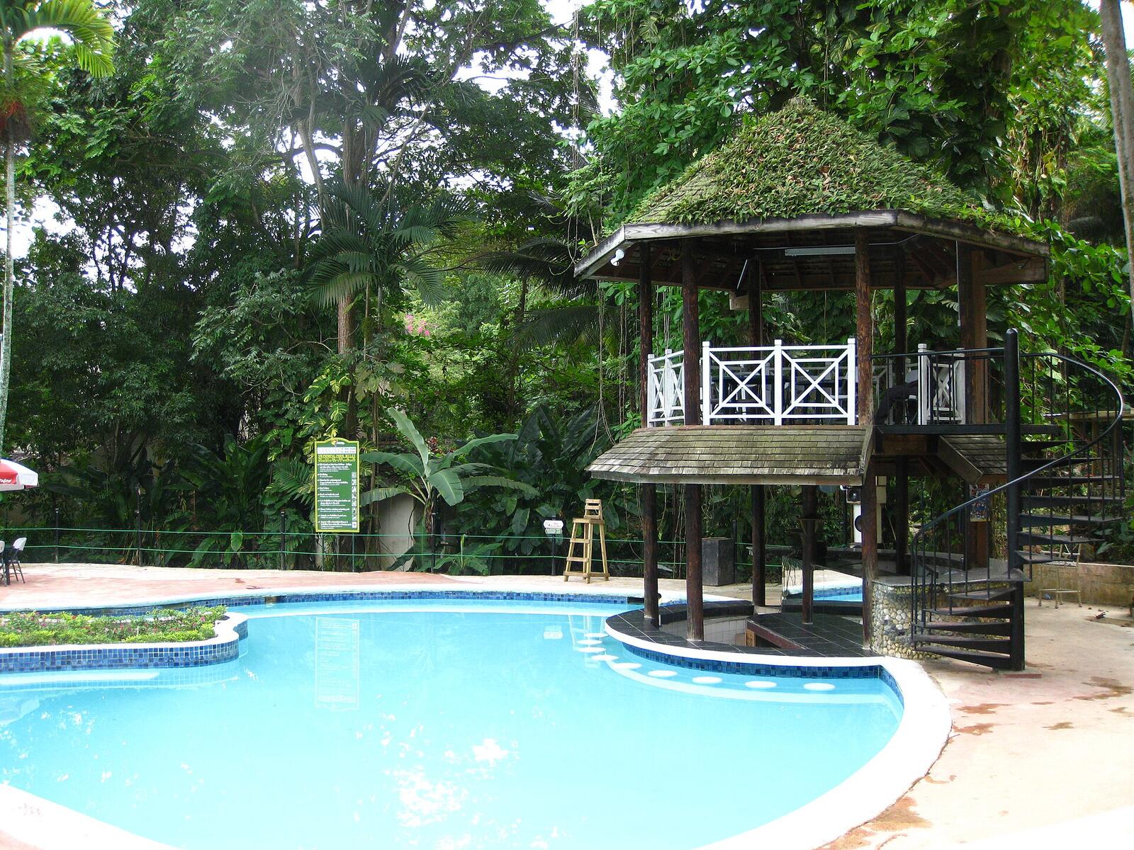 Illustrative accommodation photography for a fictional jamaica stay — illustrative style for Palm Grove Country House