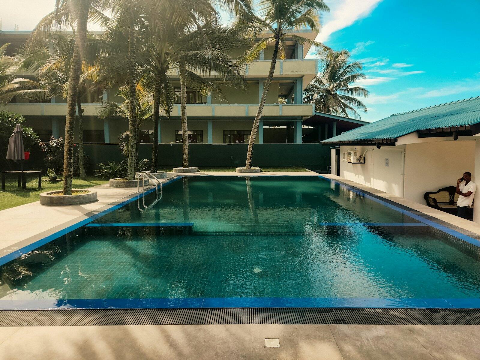 A beautiful swimming pool in a tropical setting — illustrative property style — illustrative style for Cinnamon Coast Villas