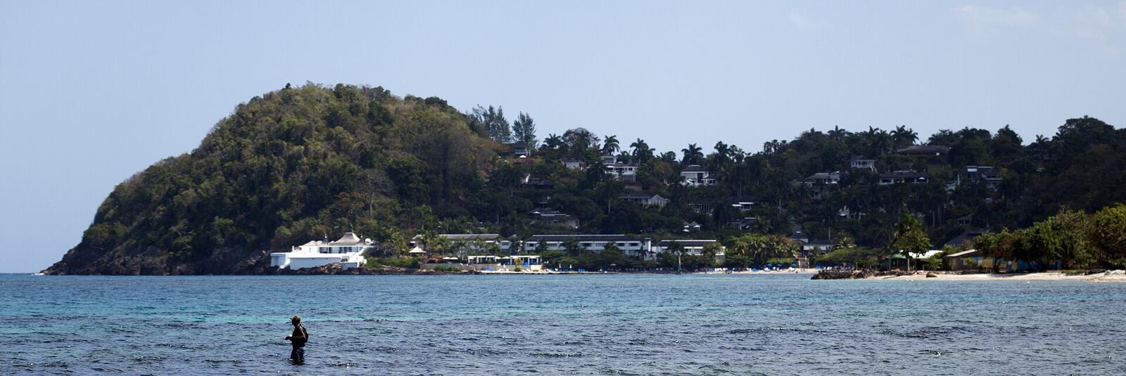 Illustrative accommodation photography for a fictional jamaica stay — illustrative style for The Harbour Atelier