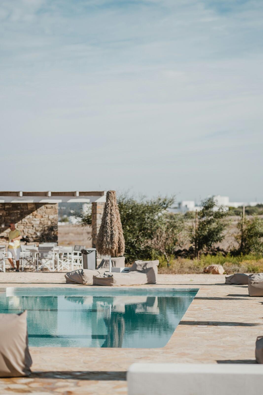rectangular white outdoor swimming pool — illustrative property style — illustrative style for Naxos Dune House