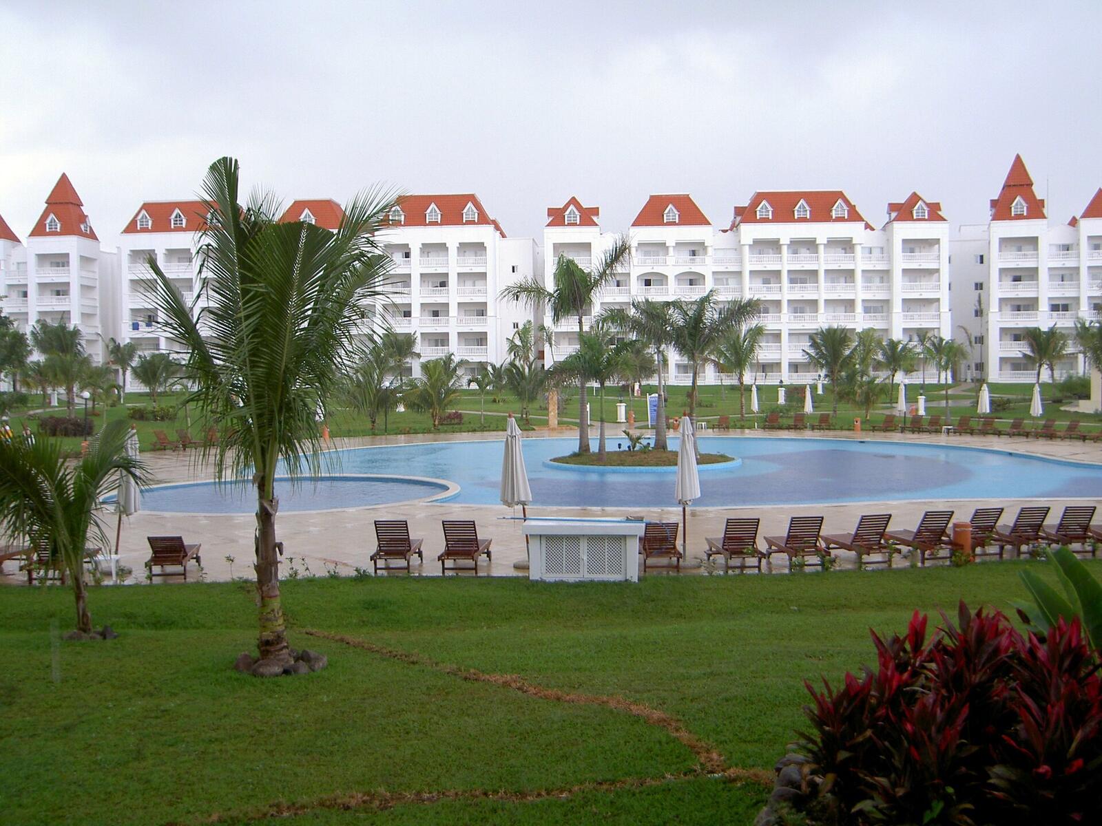 Illustrative accommodation photography for a fictional jamaica stay — illustrative style for Seville Bay Family Resort