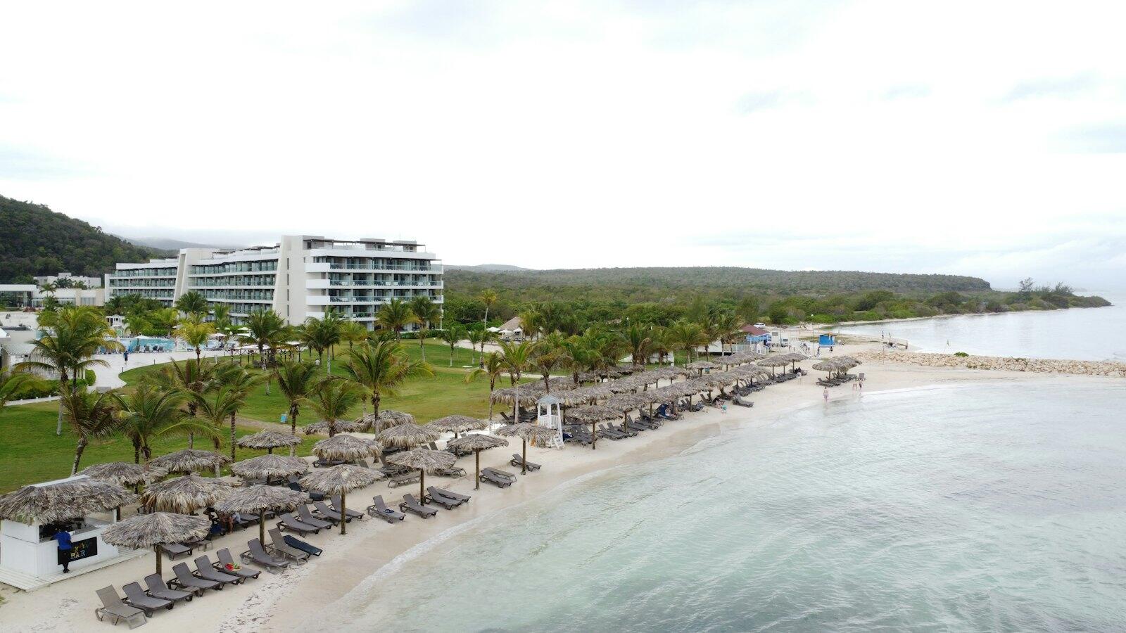 An aerial view of a beach and resort photo – Free Beach Image on Unsplash (https://unsplash.com/photos/an-aerial-view-of-a-beach-and-resort-b9ZVZnYtHPU) — illustrative property style — illustrative style for Portland Garden Retreat